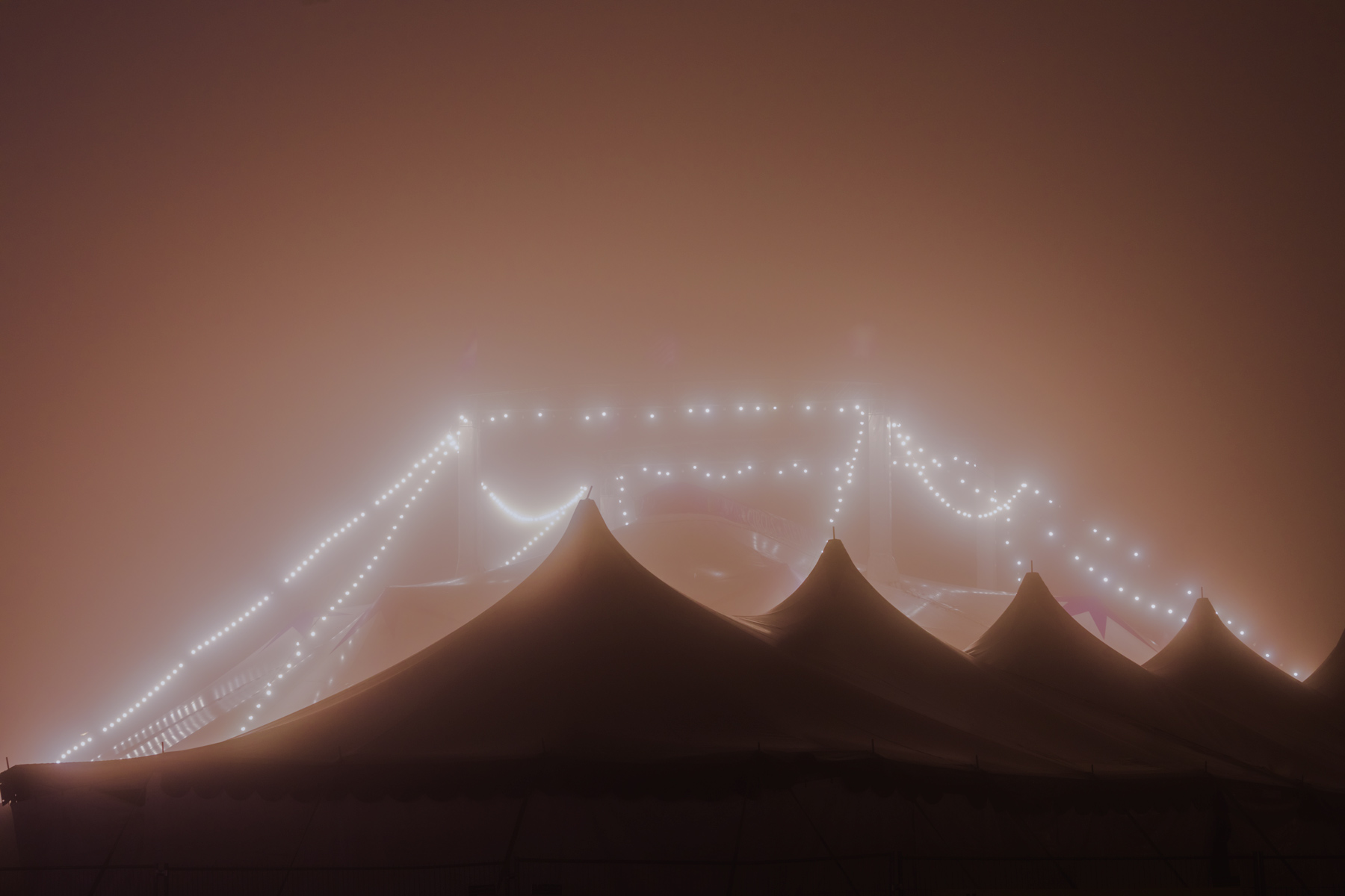 Foggy night in Vienna, lights of the circus. Fine art photography.